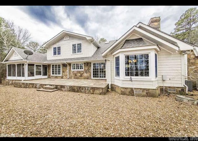 back of house with a patio, a sunroom, and central air condition unit