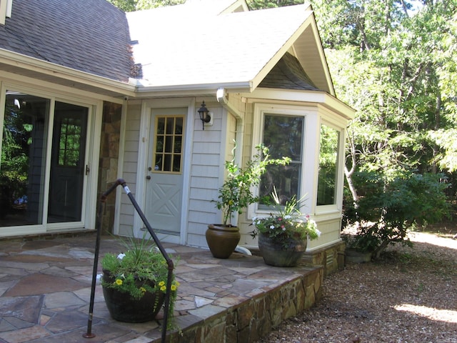 entrance to property featuring a patio area