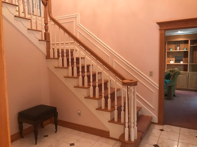 stairs with tile patterned floors