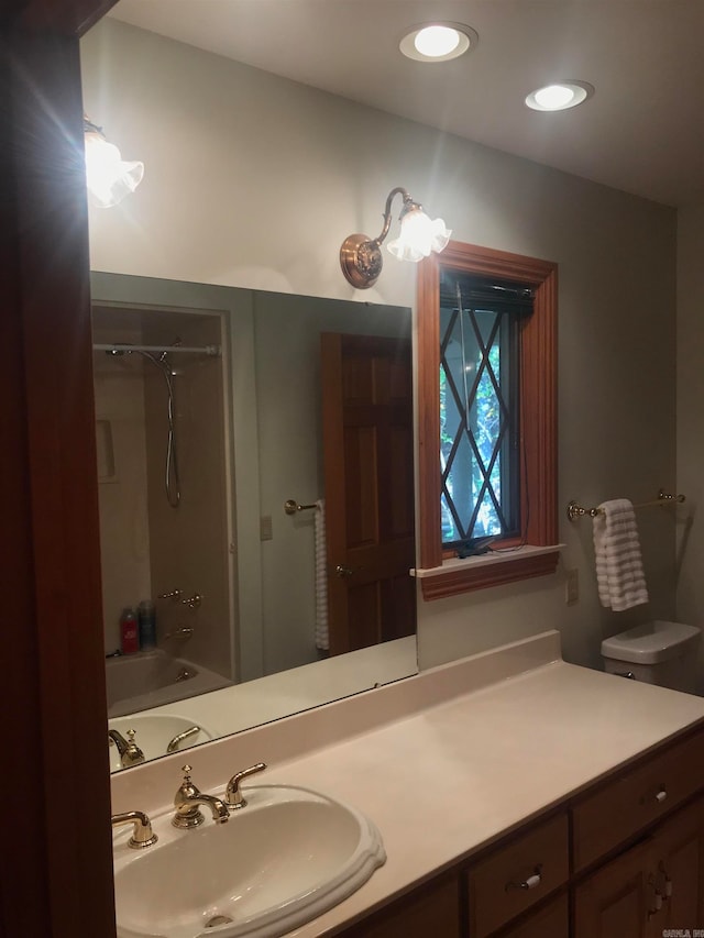 full bathroom featuring vanity, toilet, and shower / bathtub combination