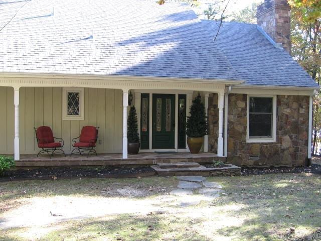 property entrance featuring covered porch