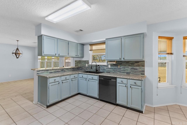 kitchen featuring dishwasher, backsplash, sink, pendant lighting, and light tile patterned floors