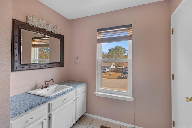 bathroom with vanity and tile patterned flooring