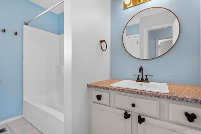 bathroom with vanity,  shower combination, and tile patterned flooring