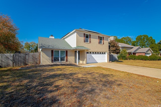 front of property with a front yard and a garage