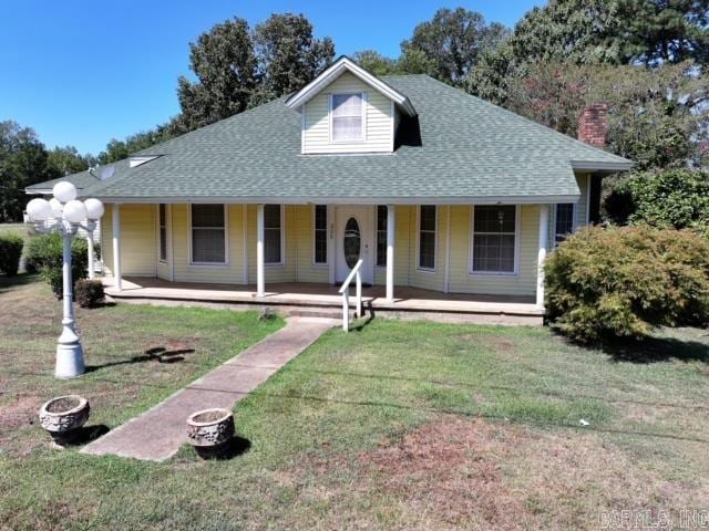 view of front of home with a front lawn and covered porch