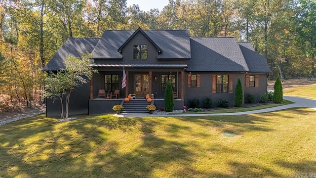 view of front facade with a front yard and a porch