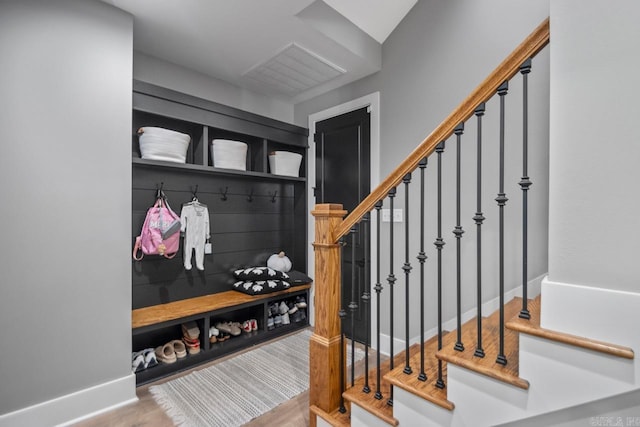 mudroom with light hardwood / wood-style flooring