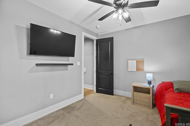 bedroom with light colored carpet and ceiling fan