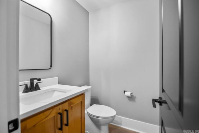 bathroom with toilet and vanity