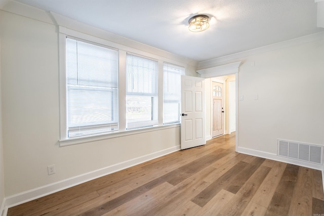 spare room with light hardwood / wood-style floors