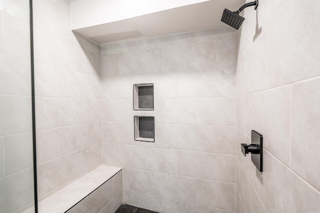 bathroom featuring tiled shower