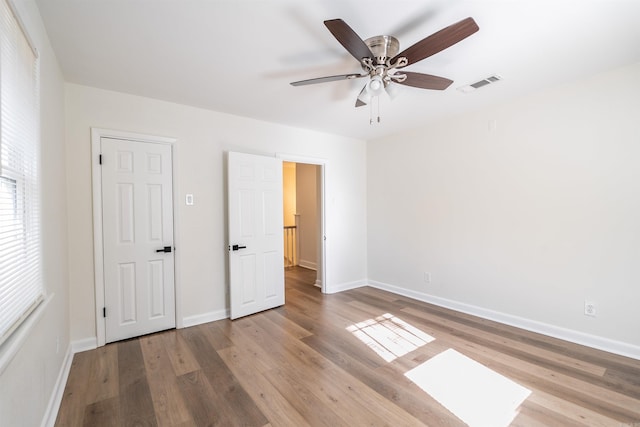 unfurnished bedroom featuring light hardwood / wood-style flooring and ceiling fan