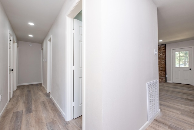 hall with light hardwood / wood-style flooring