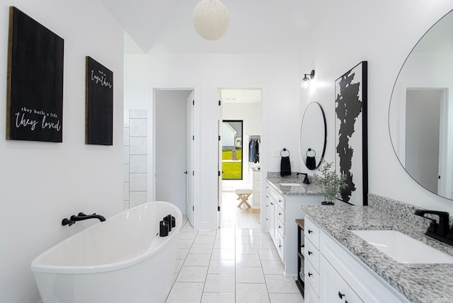 bathroom featuring vanity and a bathing tub