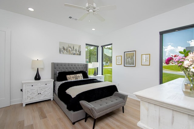 bedroom with light hardwood / wood-style floors and ceiling fan