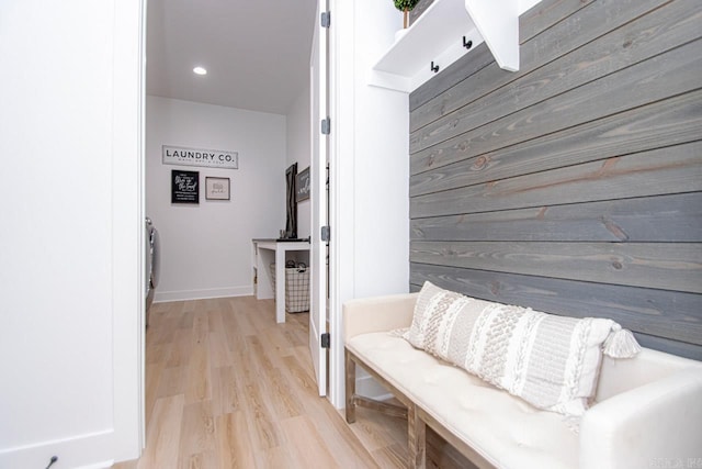 mudroom with light hardwood / wood-style flooring