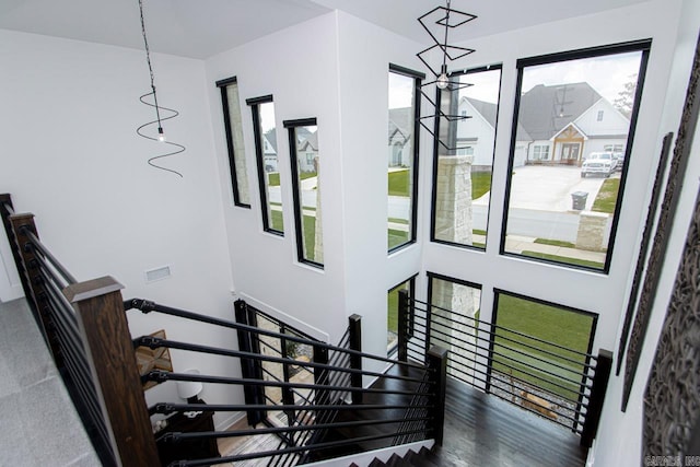 stairs featuring hardwood / wood-style floors