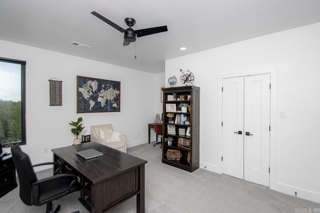 office featuring light colored carpet and ceiling fan