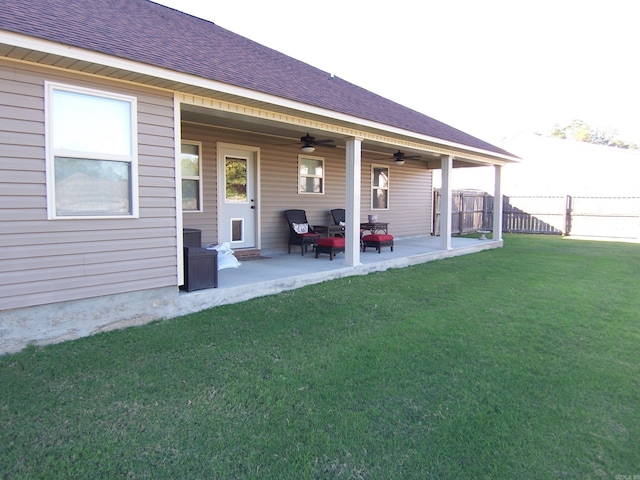 back of house featuring a yard, a patio, and ceiling fan