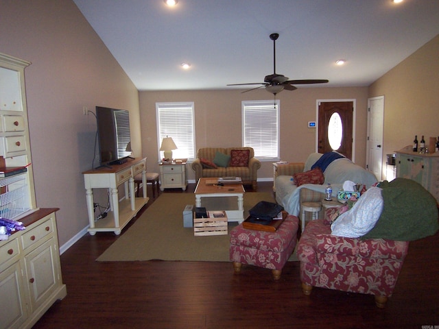 living room with lofted ceiling, dark wood-type flooring, and ceiling fan