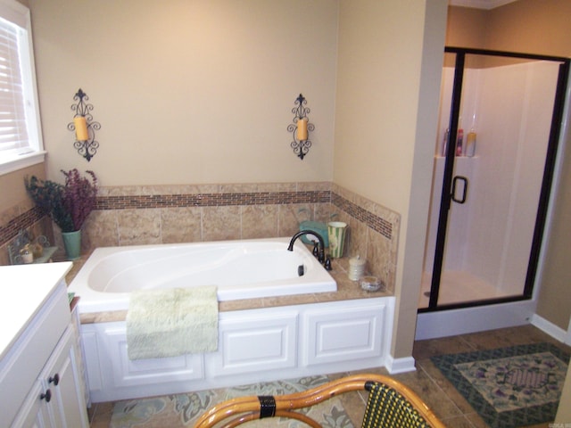 bathroom with vanity, shower with separate bathtub, and tile patterned flooring