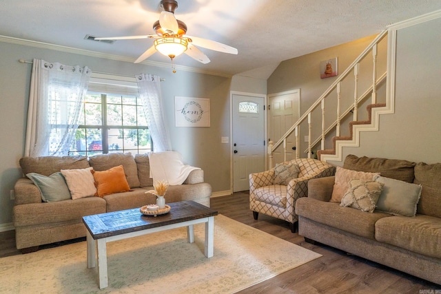 living room with crown molding, hardwood / wood-style flooring, vaulted ceiling, and ceiling fan