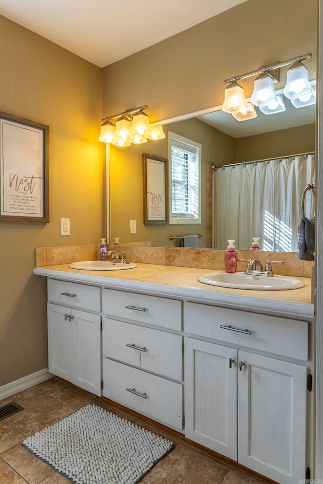 bathroom with vanity and walk in shower