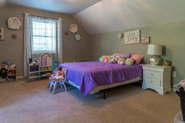 carpeted bedroom with vaulted ceiling