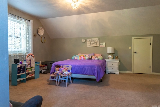 bedroom featuring lofted ceiling and light colored carpet