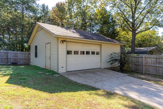 garage featuring a lawn