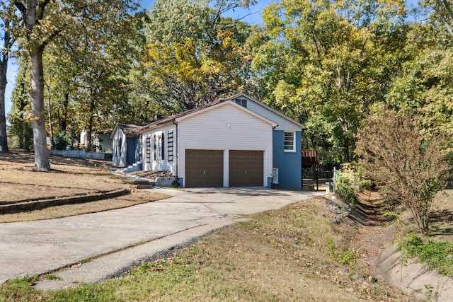 view of side of property featuring a garage