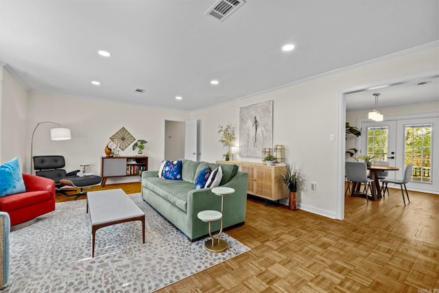 living room featuring crown molding, parquet floors, and french doors