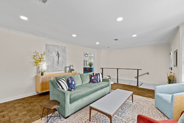 living room with ornamental molding and parquet floors