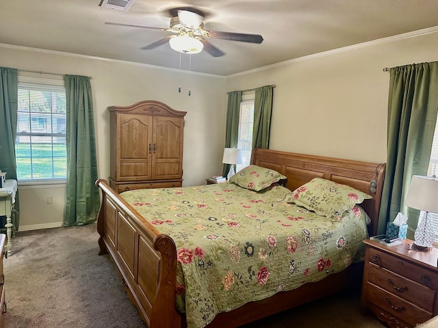 bedroom with crown molding, dark colored carpet, and ceiling fan