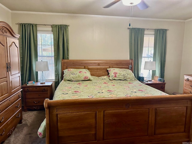 bedroom with ceiling fan, crown molding, and dark colored carpet