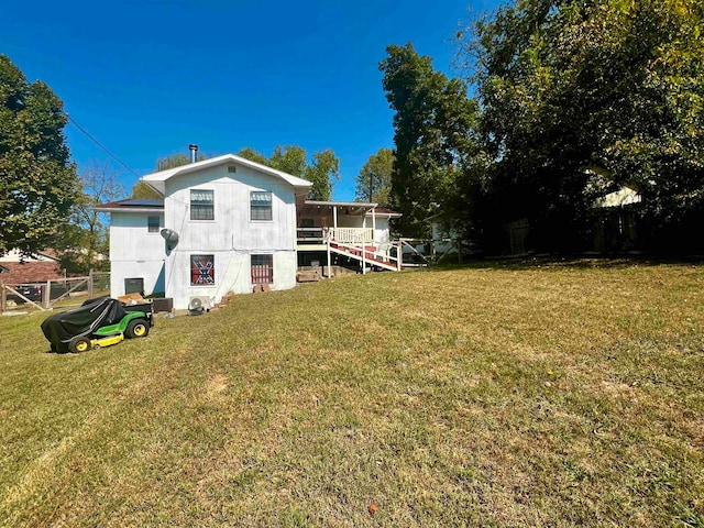 back of property featuring a yard