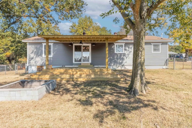 view of front of property with a front yard and a pergola