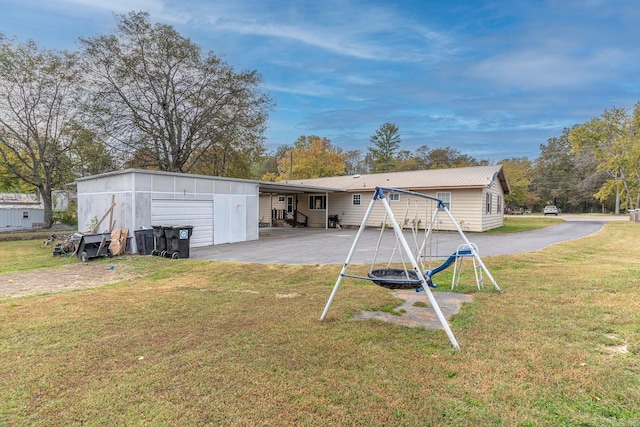 rear view of house with a lawn