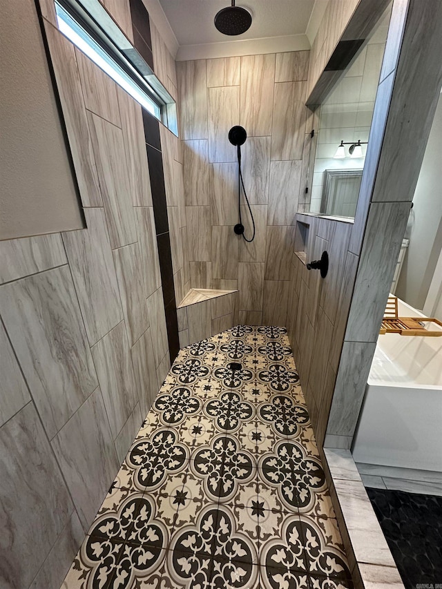 bathroom featuring a tile shower and crown molding