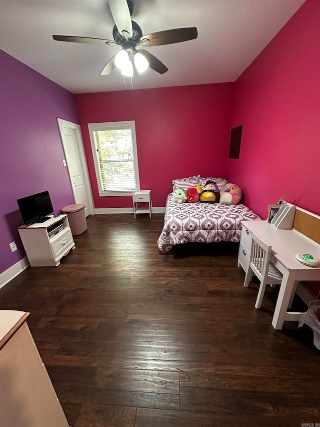 unfurnished bedroom featuring ceiling fan and dark hardwood / wood-style floors