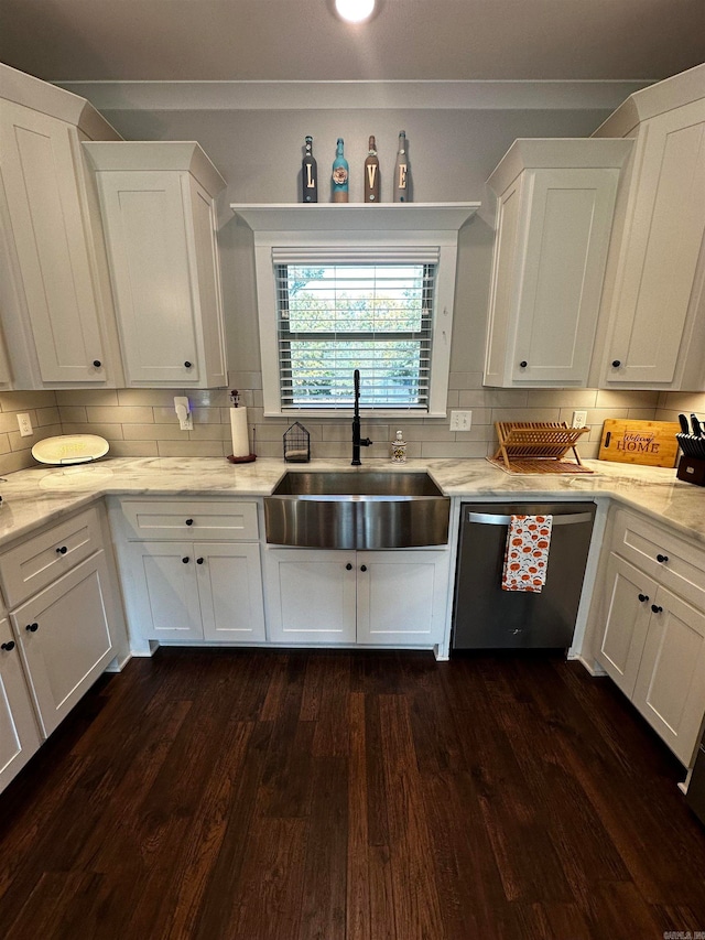 kitchen with white cabinetry, sink, stainless steel dishwasher, and dark hardwood / wood-style flooring