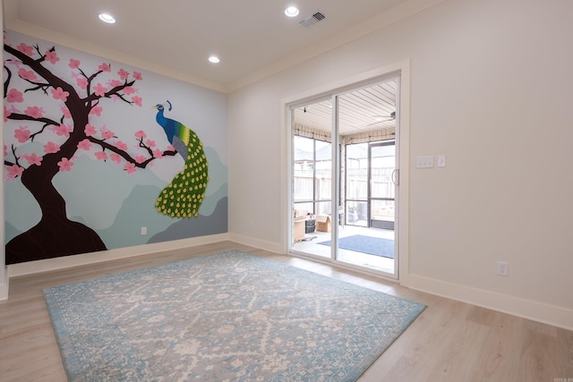 empty room with light wood finished floors, recessed lighting, visible vents, and baseboards