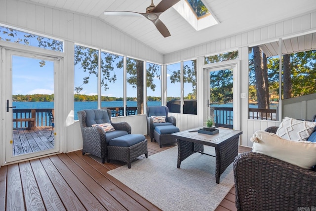 sunroom featuring a water view, ceiling fan, and lofted ceiling