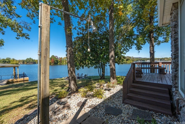 exterior space with a water view and a yard