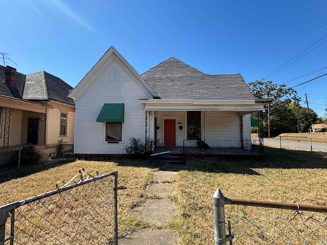 bungalow-style house with a front yard and a porch