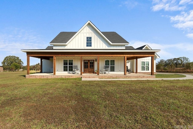 view of front of home featuring a front lawn and a patio area