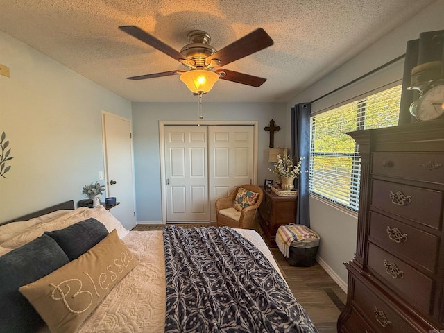 bedroom with wood-type flooring, multiple windows, a closet, and ceiling fan