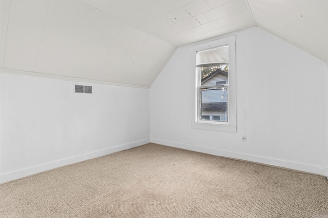 bonus room featuring carpet and lofted ceiling