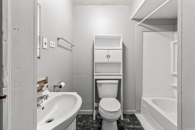 full bathroom featuring toilet, washtub / shower combination, and sink